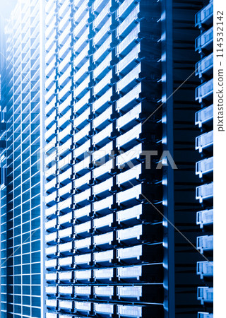 cluster of hard drives stacked inside data storage cabinet cluster of hard drives stacked inside data storage cabinet 114532142