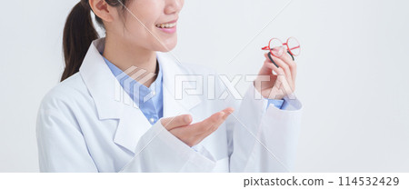 Ophthalmologist with glasses for child's amblyopia Ophthalmologist with glasses for child's amblyopia 114532429
