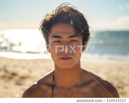 Asian man smiling by the sea 114533237