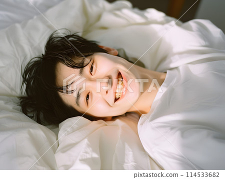Asian man waking up refreshed in the morning sunlight 114533682