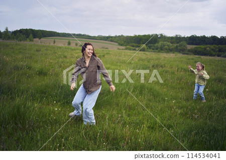 mother plays catch up with her daughters mother plays catch up with her daughters 114534041