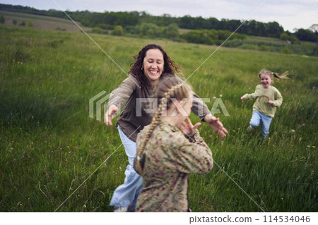mother plays catch up with her daughters 114534046