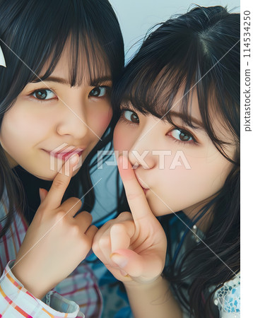 An intimate moment between two young Asian women 114534250