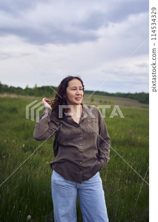 portrait of a middle aged woman in the field portrait of a middle aged woman in the field 114534329