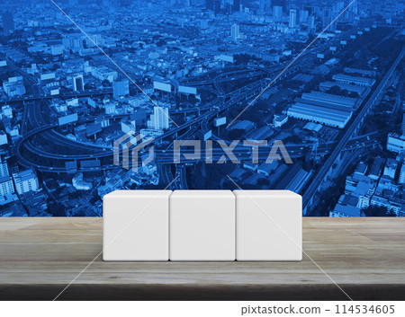 Three white block cubes on wooden table 114534605