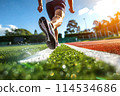 A man runs in a stadium. 114534686