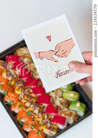 Sushi roll Philadelphia with salmon, smoked eel, avocado, cream cheese on black background. Sushi menu. Japanese food. 114534779