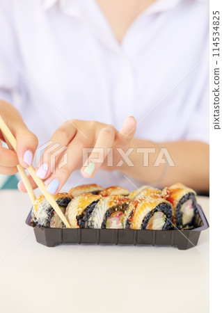 Sushi roll Philadelphia with salmon, smoked eel, avocado, cream cheese on black background. Sushi menu. Japanese food. 114534825