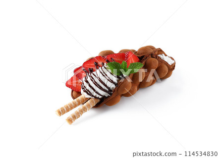 Hong kong or bubble waffle with ice cream, fruits, chocolate sauce and colorful candy isolated on white background 114534830