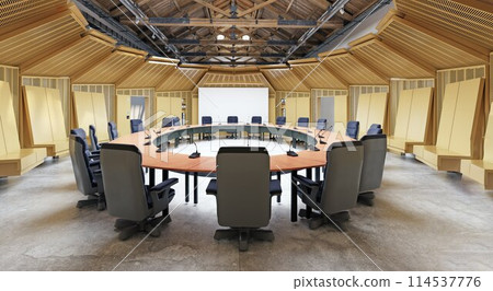 Round conference room table and chairs in a hall with modern interior design 114537776