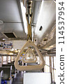 Front view of the handrail inside a local train 114537954