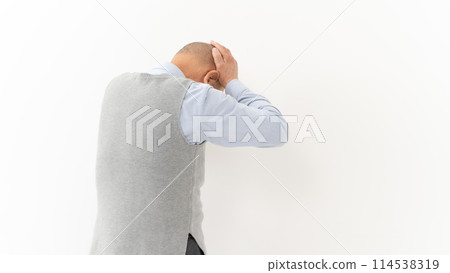Senior man headache back view 114538319