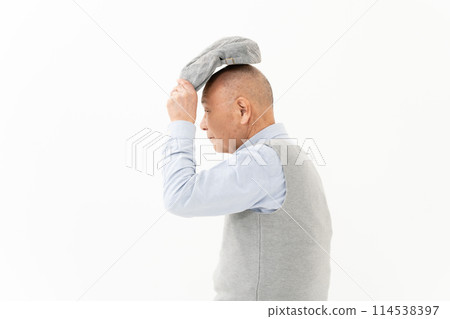 Senior man wearing a hat turning around Senior man wearing a hat turning around 114538397