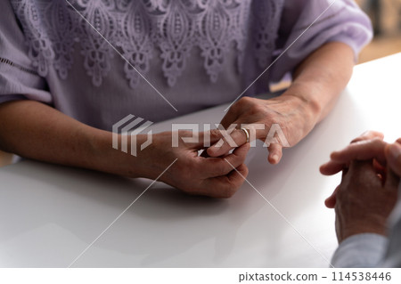 Senior couple, discussion, hand, ring Senior couple, discussion, hand, ring 114538446