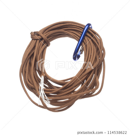 Brown Climbing Rope roll fly in air. Strong safety climbing rope for sport mountain hobby, need safety gear to lock hold weight of climber rope. White background isolated 114538622