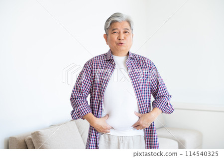 Senior man who cares about stomach circumference Senior man who cares about stomach circumference 114540325