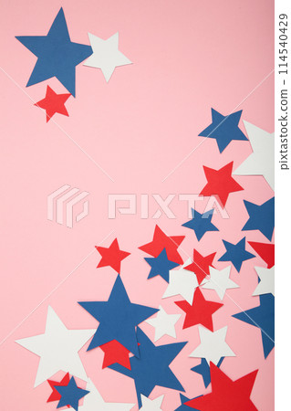 American independence day, celebration, patriotism and holidays concept - red, white and blue paper stars on pink background. American independence day, celebration, patriotism and holidays concept - red, white and blue paper stars on pink background. 114540429