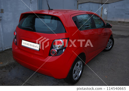 Beautiful red car.Red hatchback, rear view. Comfortable, roomy city car. Beautiful red car.Red hatchback, rear view. Comfortable, roomy city car. 114540665