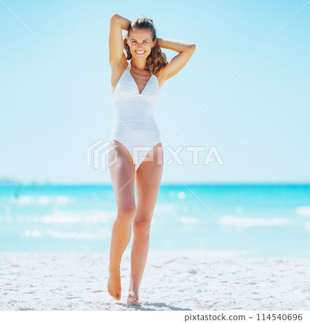 happy young woman relaxing on beach happy young woman relaxing on beach 114540696