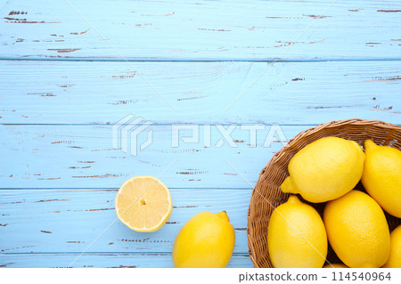 Lemon isolated in basket on blue background. Tropical fruit. 114540964