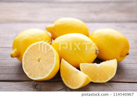 Fresh lemon and half of lemon on grey background. Tropical fruit. 114540967