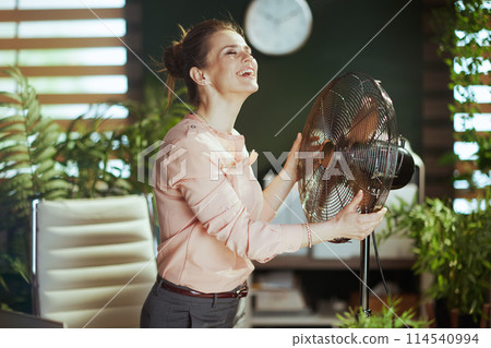 happy modern business woman in modern green office happy modern business woman in modern green office 114540994