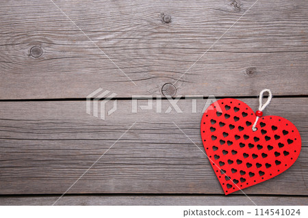 Red wooden hearts on wooden background 114541024