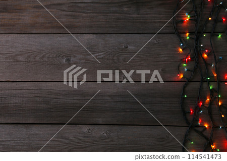 Christmas garland lights on grey background, copy space Christmas garland lights on grey background, copy space 114541473