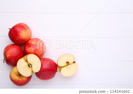 Fresh red apples on a white wooden background Fresh red apples on a white wooden background 114541602