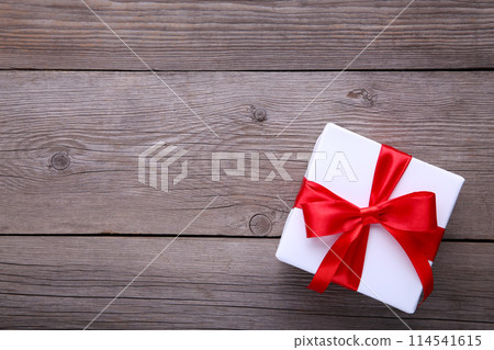 Gift presents box on a grey background. Gift presents box on a grey background. 114541615