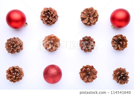 Christmas composition with pine cones and red christmas balls on white background Christmas composition with pine cones and red christmas balls on white background 114541640