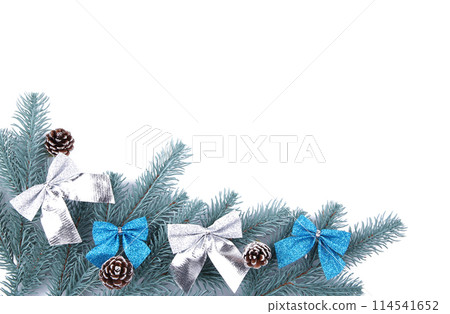 Fir tree branches with christmas decoration on a white background 114541652
