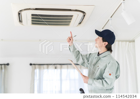 Workers inspecting air conditioners 114542034