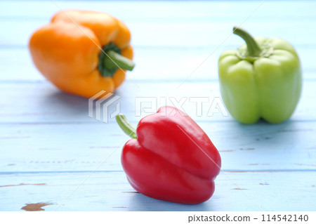 Colorful pepper on a blue background. Studio Photo Colorful pepper on a blue background. Studio Photo 114542140