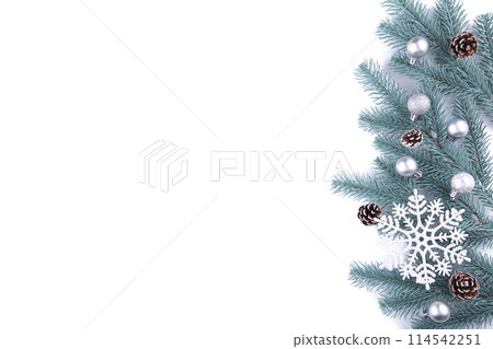 Christmas tree branches with christmas decoration on a white background 114542251