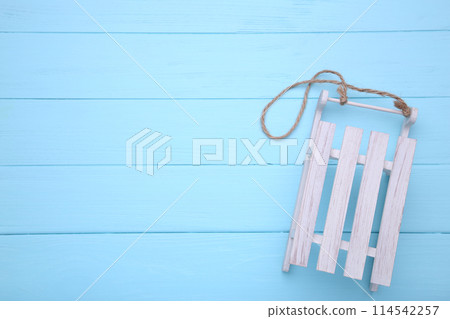 Christmas toy sledge on a blue background 114542257