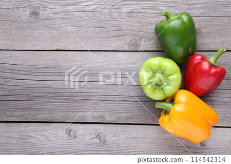 Colorful pepper on a grey wooden background Colorful pepper on a grey wooden background 114542314