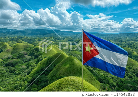 flag of Cuba stands proudly atop a lush green hill, symbolizing strength and resilience against a backdrop of natural beauty. flag of Cuba stands proudly atop a lush green hill, symbolizing strength and resilience against a backdrop of natural beauty. 114542858