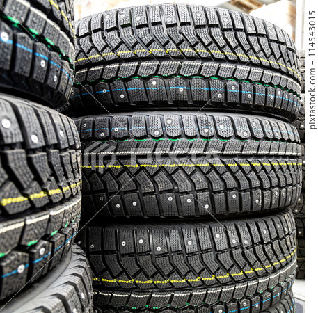 Winter tires stacked up for sale in the superstore 114543015