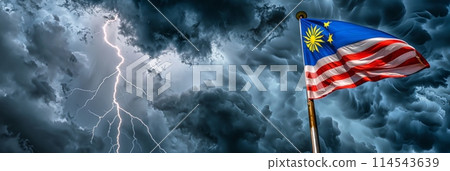 vibrant flag of Malaysia proudly flutters in the wind against a dramatic stormy sky, creating a striking contrast of colors and emotions. 114543639