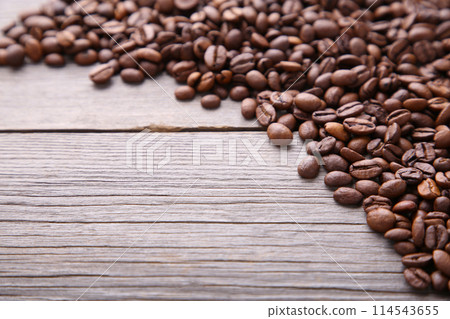 Natural coffee beans on grey wooden background 114543655