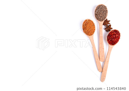 Spices mix on wooden spoons isolated on a white background. Top view 114543840