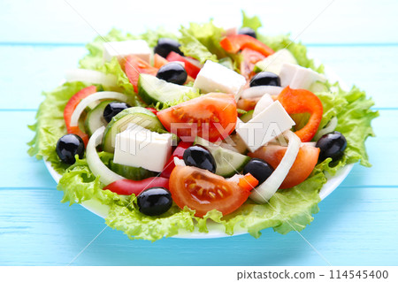Fresh vegetable salad on blue wooden background 114545400