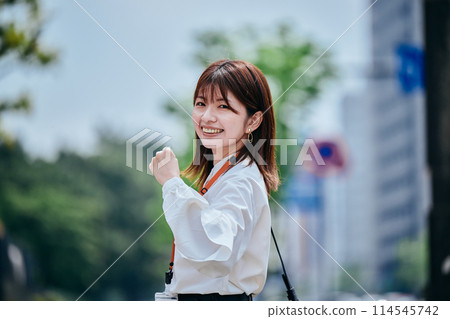 A young woman who plays guts pose A young woman who plays guts pose 114545742