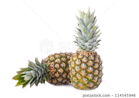 Two whole pineapples isolated on white background Two whole pineapples isolated on white background 114545946