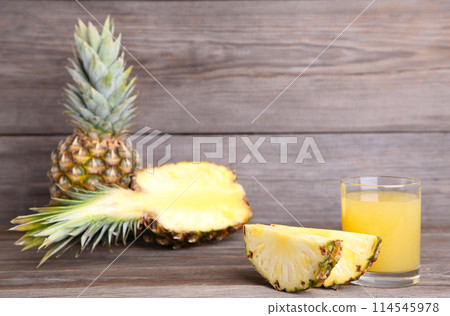 Fresh pineapple juice in the glass with slices 114545978