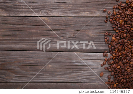 Natural coffee beans on grey wooden background 114546357