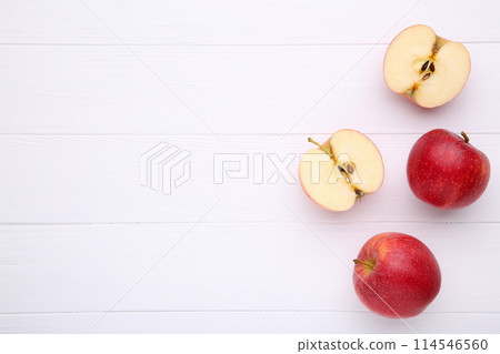 Fresh red apples on a white wooden background 114546560