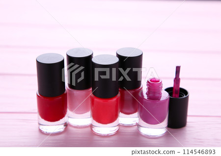 Group of bright nail polishes on pink Group of bright nail polishes on pink 114546893