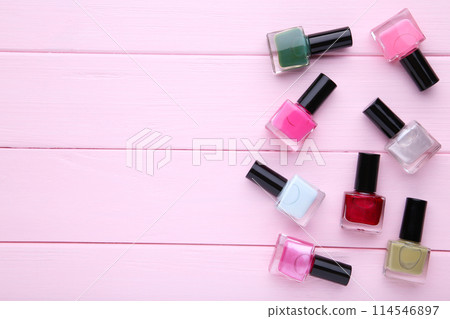 Group of bright nail polishes on pink Group of bright nail polishes on pink 114546897